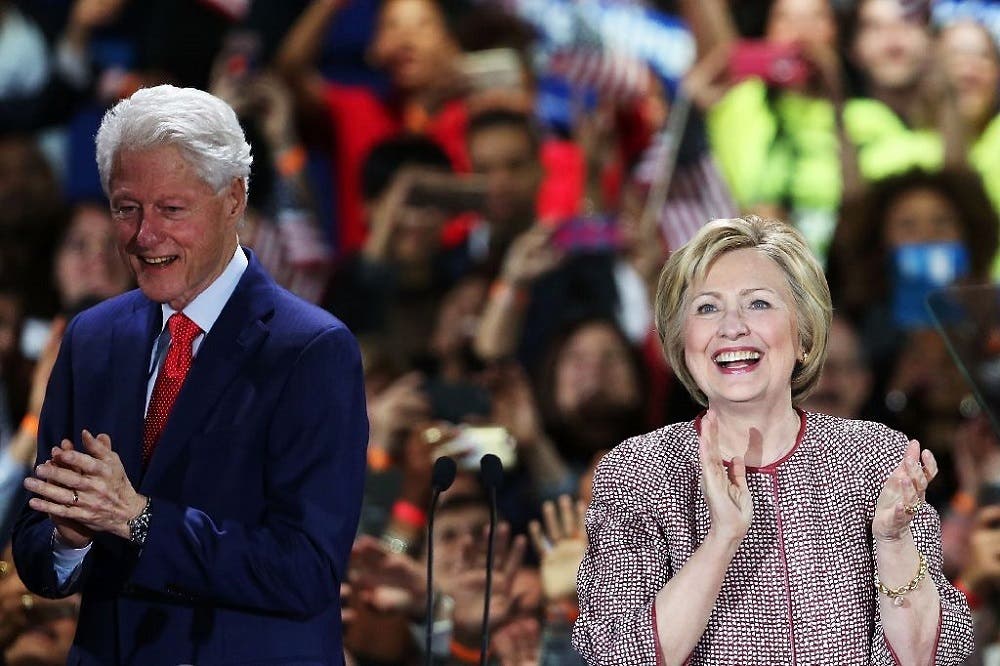 Democratic presidential candidate Hillary Clinton on stage with her husband Bill Clinton after winning the New York primary on April 19, 2016 (AFP)