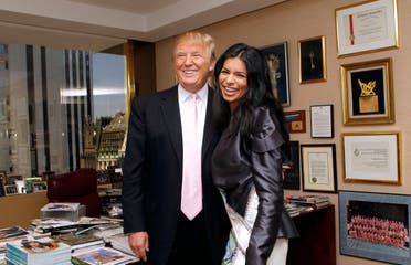 Donald Trump and newly-crowned Miss USA Rima Fakih laugh while posing together in Trump's office Thursday, May 20, 2010 in New York. (AP)