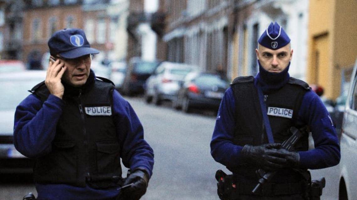 Belgian police stand guard on a street in Verviers during an anti-terror raid in January (AFP Photo/John Thys)