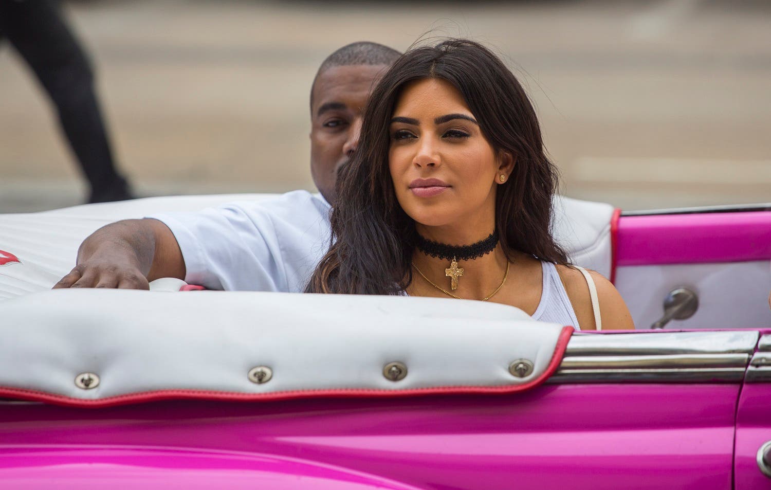 American reality-show star Kim Kardashian West and her husband, rap superstar, Kanye West ride on a classic car in Havana, Cuba, Wednesday, May 4, 2016. AP