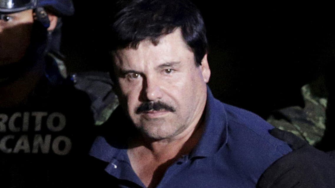 Recaptured drug lord Joaquin "El Chapo" Guzman being escorted by soldiers. (Reuters)