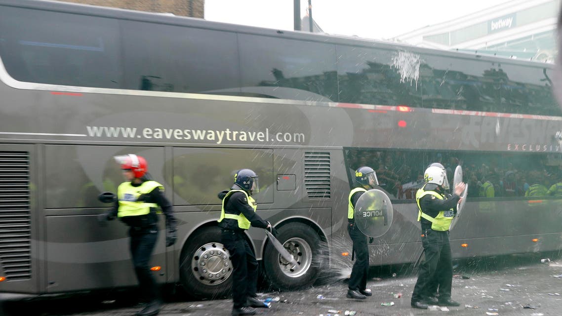 Bottles are thrown at the Manchester United team bus before the match 