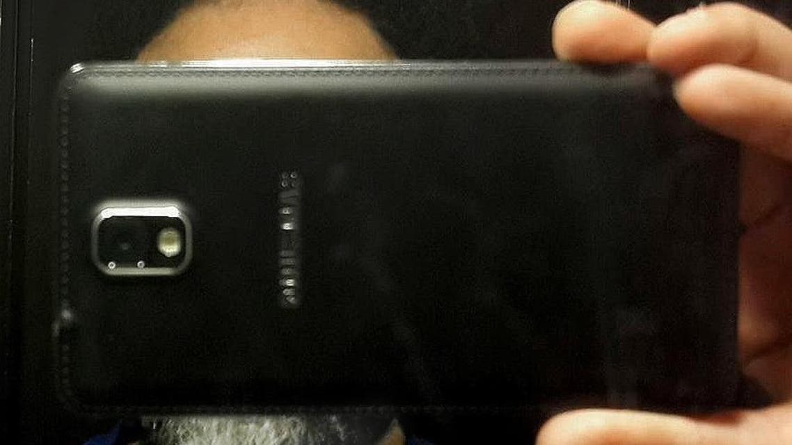 This undated handout image provided by Egyptian activist Sherif Azer, shows him posing for a 'selfie' part of an online campaign demanding the release from detention of members of a satirical street group whose selfie-style video clips mocked the country's president, in Egypt. Activists on Thursday, May 12, 2016 posted phone-wielding selfies entitled "does a mobile phone camera scare you?" and directed at President Abdel-Fattah el-Sissi. Police this week arrested four members of the group Awlad el-Shawarea, or "Street children." A fifth member was arrested over the weekend but was later released on bail. They are facing a host of charges including inciting terror attacks and street protests as well as insulting state institutions. (Courtesy of Sherif Azer via AP)