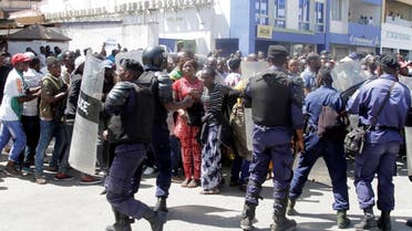 Riot police hold their position as they attempt to disperse supporters of Democratic Republic of Congo's opposition Presidential candidate Moise Katumbi as they escort him to the prosecutor's office over government allegations he hired mercenaries in a plot against the state in Lubumbashi, the capital of Katanga province, May 13, 2016 reuters