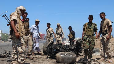 Soldiers gather at the site of a car bomb attack in a central square in the port city of Aden, Yemen, May 1, 2016, that targeted the city's security chief for the second time in a week.  reuters