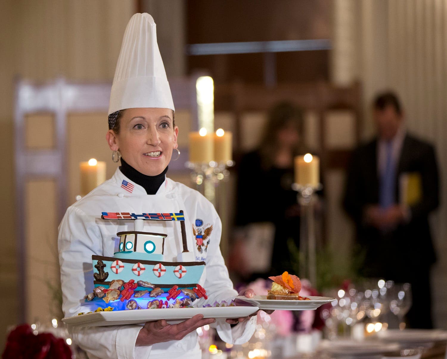 White House Executive Pastry Chef Susan Morrison shows the dessert during a press preview in the State Dining Room at the White House in Washington, Thursday, May 12, 2016, for the state dinner in honor of the official visit of Nordic leaders. (AP