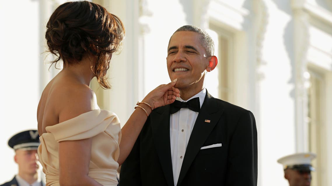 U.S. First Lady Michelle Obama touches the chin of U.S. President Barack Obama before the arrival of Nordic leaders at the White House in Washington, U.S., May 13, 2016