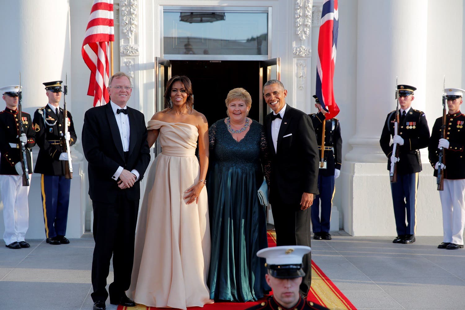 U.S. President Barack Obama and First Lady Michelle Obama welcome Erna Solberg (2nd R) Prime Minister of Norway and Mr. Sindre Finnes (L) at a state dinner in the White House during the U.S.-Nordic Leaders Summit in Washington, U.S. May 13, 2016. REUTERS