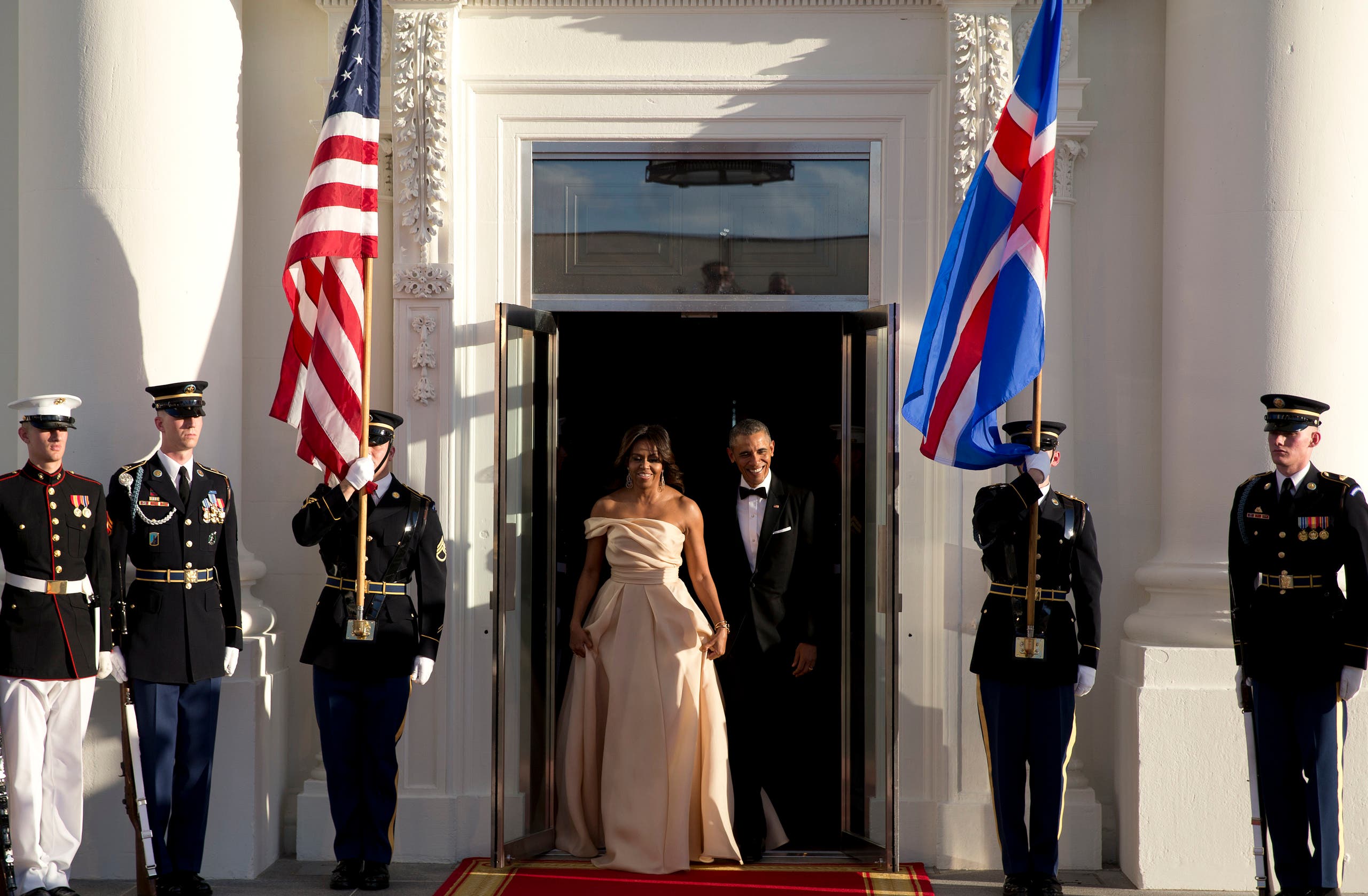 The president accidentally stepped on his wife’s dress as they made their entrance, but both still looked impeccable. (AP)
