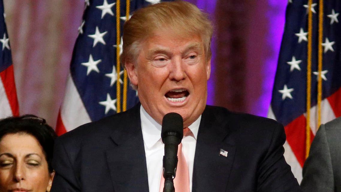 In this March 15, 2016 file photo, Donald Trump's campaign manager Corey Lewandowski listens at left are Trump speaks in Palm Beach, Fla. (AP)