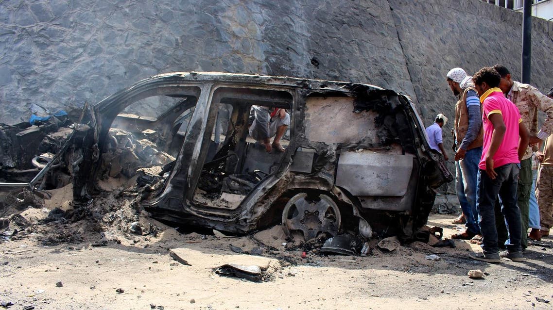 Yemenis inspect the scene of a car bomb attack that killed a Yemeni senior official in the southern port city of Aden, Yemen, Sunday, Dec. 6, 2015. A huge explosion killed the governor of Yemen's southern Aden province and six of his bodyguards on Sunday, security officials said, in an attack that was later claimed by a local Islamic State affiliate. (AP)