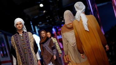 Models present creations by Malaysian designer Aidijuma during Istanbul Modest Fashion Week at the historical Haydarpasa train station in Istanbul, Turkey May 13, 2016. REUTERS