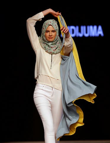 A model presents a creation by Malaysian designer Aidijuma during Istanbul Modest Fashion Week at the historical Haydarpasa train station in Istanbul, Turkey May 13, 2016. REUTERS