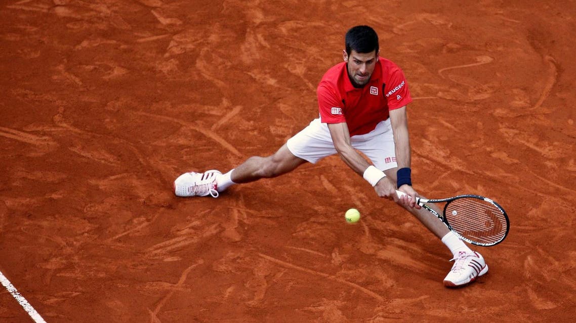 Novak Djokovic of Serbia v Andy Murray of Britain - Madrid, Spain - 8/5/16 Djokovic returns the ball. REUTERS