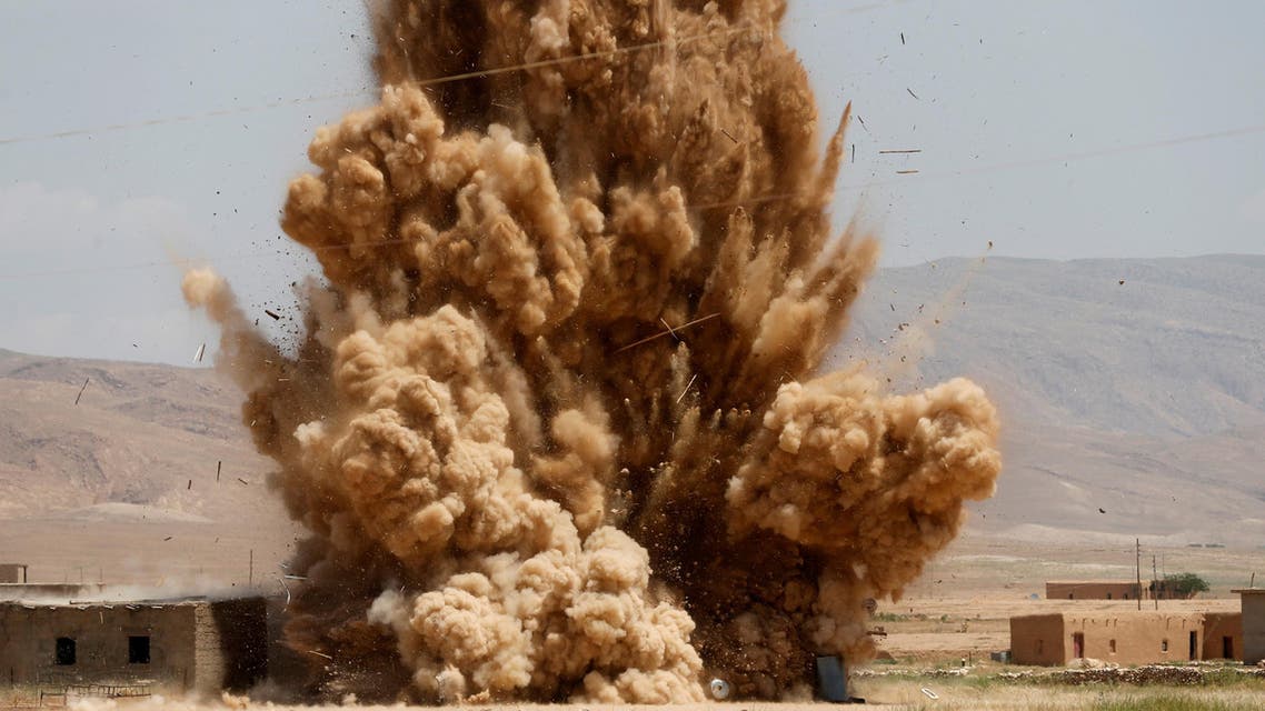 Members of the Sinjar Resistance Units (YBS), a militia affiliated with the Kurdistan Workers' Party (PKK), detonate improvised explosive devices captured from Islamic State fighters near village of Umm al-Dhiban, northern Iraq, April 30, 2016. (Reuters)