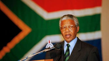 African National Congress President Nelson Mandela delivers his victory speech against a backdrop of the new South African flag, at a hotel in downtown Johannesburg, May 2, 1994. (AP)