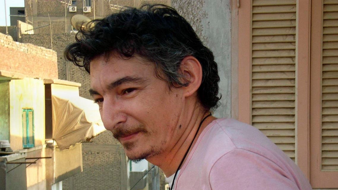 This June 2007 file photo shows Eric Lang, a French resident of Cairo, who died Sept. 13, 2013 while in police custody in the Egyptian capital, on the balcony of an apartment in the Sayeda Zeinab neighborhood of Cairo, Egypt. On Sunday, May 15, 2016 Egypt's official MENA news agency said a Cairo court has convicted six men of manslaughter and sentenced them to seven years in prison for beating Lang to death while in police custody in 2013. (AP)