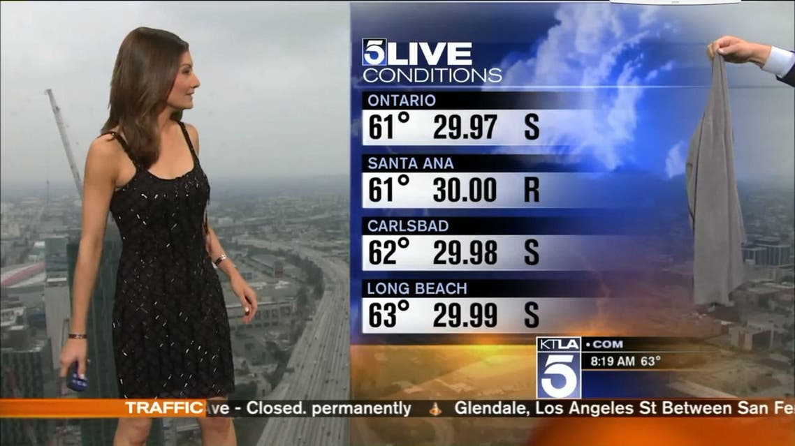 KTLA-TV weather anchor Liberte Chan's co-host handed her a dull-looking, gray sweater. (Screenshot)