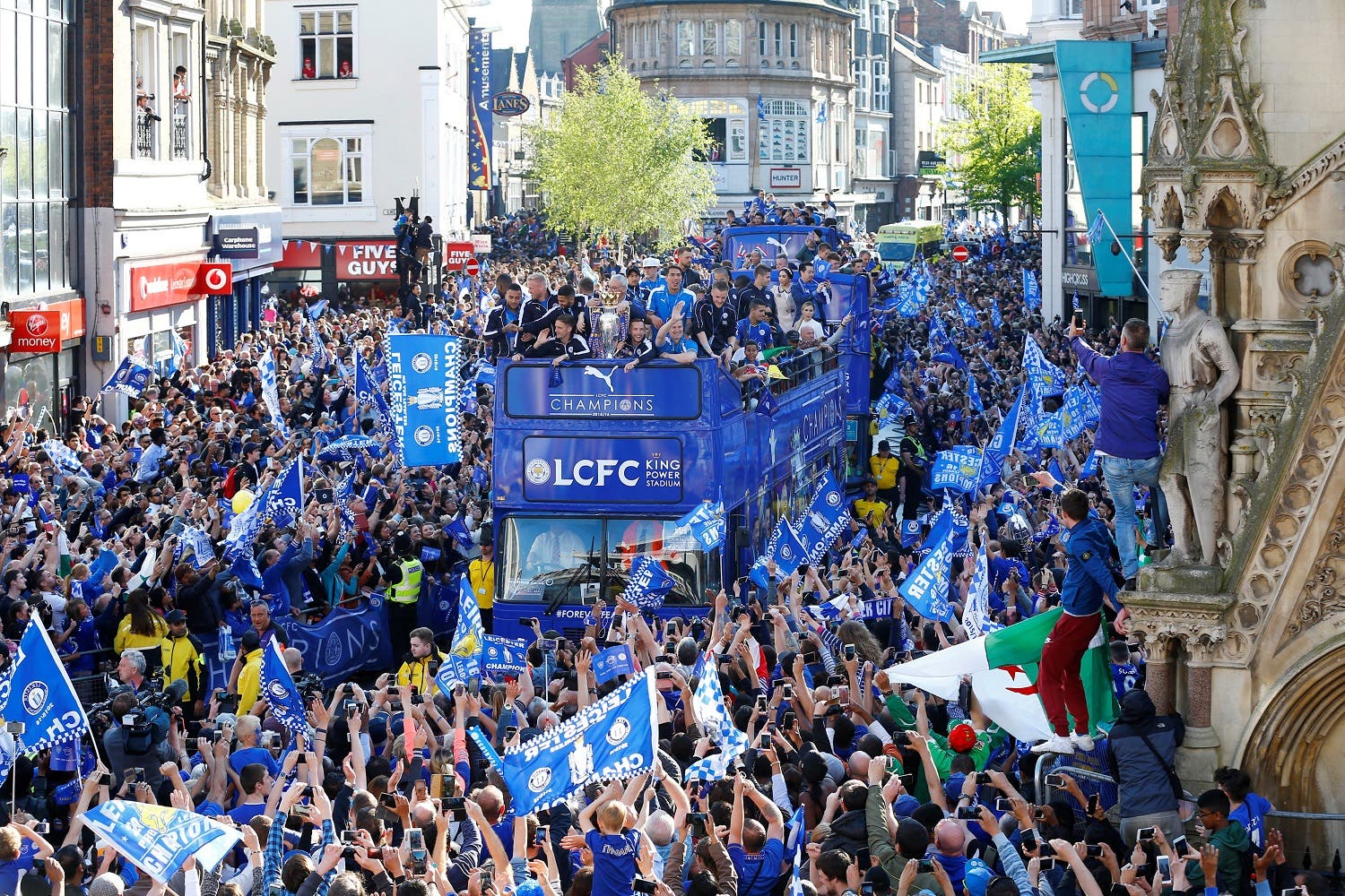 eicester City celebrate with the trophy on the bus during the parade (Reuters)