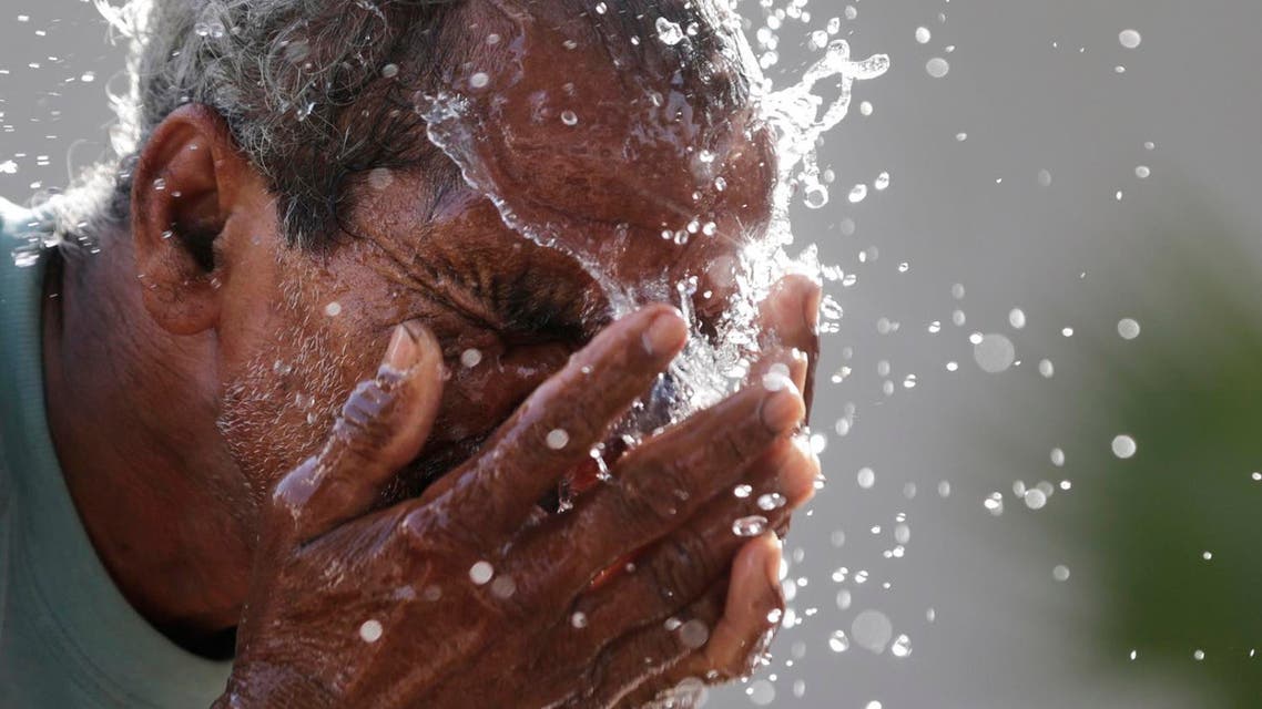 An Indian man splashes water on his face as he tries to cool himself on a hot summer afternoon in Lucknow, India, Monday, May 16, 2016. Much of India has been suffering from a heat wave for weeks along with a severe drought that has decimated crops, killed livestock and left at least 330 million Indians without enough water for their daily needs. (AP)
