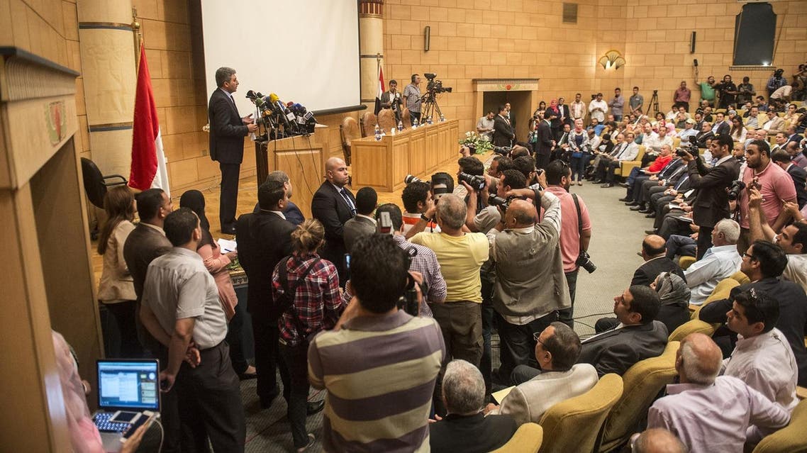 Egypt's Aviation Minister Sherif Fathy (L) speaks during a press conference on May 19, 2016. (AFP)