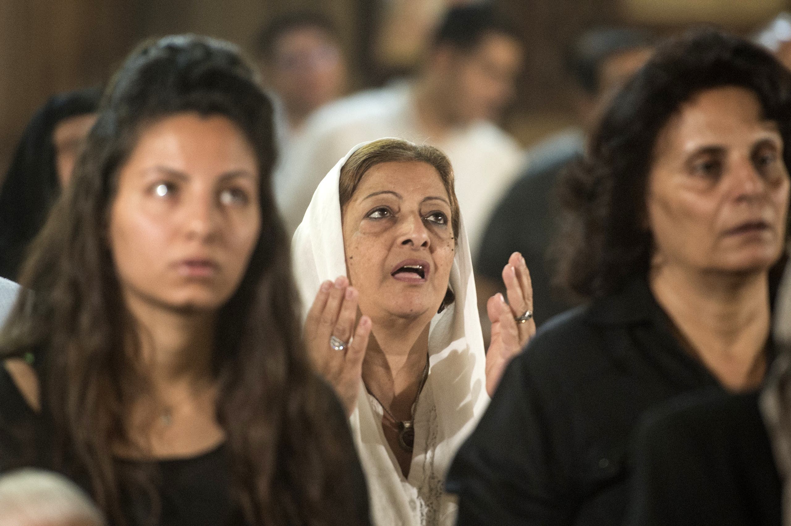 Relatives and friends of the cabin crew and passengers, who were on board the EgyptAir plane that crashed in the Mediterranean, attend a mourning ceremony on May 22, 2016 at a Church in Cairo. (AFP)