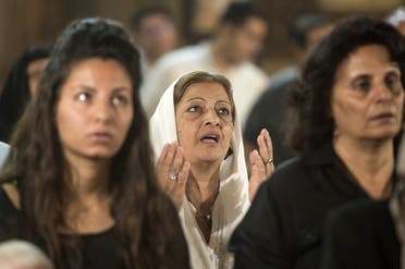 Relatives and friends of the cabin crew and passengers, who were on board the EgyptAir plane that crashed in the Mediterranean, attend a mourning ceremony on May 22, 2016 at a Church in Cairo. (AFP)