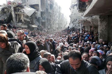 Pictured Desperate refugees queue for food at camp south of the Syrian capital Damascus.  (AFP)