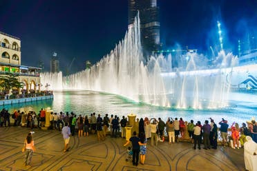 People watch a fountain display at an upscale shopping mall in Dubai, the United Arab Emirates. Jones ranks the UAE as being among the world's top ten happiest countries. (Shutterstock)