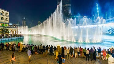 People watch a fountain display at an upscale shopping mall in Dubai, the United Arab Emirates. Jones ranks the UAE as being among the world's top ten happiest countries. (Shutterstock)