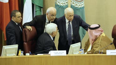 Palestinian president Mahmud Abbas (C-L) and Palestinian chief negotiator, Secretary General of the Palestine Liberation Organisation (PLO), Saeb Erekat (2-L), Arab League Secretary General Nabil al-Arabi (2-R) and Bahrain's Foreign Minister Khalid bin Ahmed al-Khalifa (R) speak during a meeting of Arab foreign ministers to discuss a French peace initiative in the Egyptian capital Cairo, on May 28, 2016. AFP