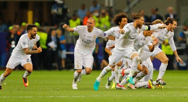Real Madrid players celebrate after Cristiano Ronaldo scores the winning penalty reuters