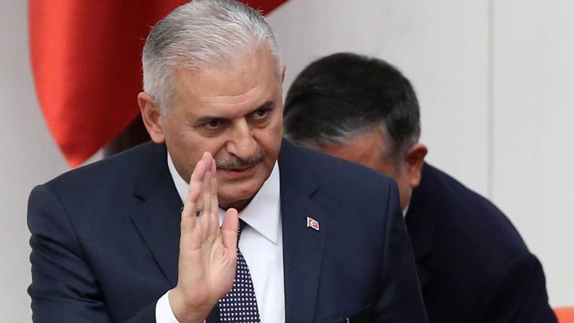 Turkey's new Prime Minister Binali Yildirim prepares to take his seat during the general session at the Grand National Assembly of Turkey (TBMM) in Ankara, Turkey on May 29, 2016. (afp)