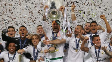 Real Madrid's Sergio Ramos lifts the trophy as they celebrate winning the UEFA Champions League Reuters