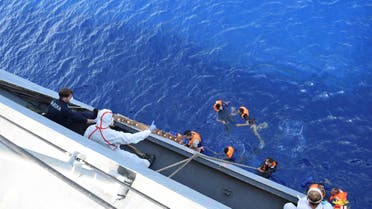 Migrants from a capsized boat are rescued during a rescue operation by Italian navy ships "Bettica" and "Bergamini" off the coast of Libya in this handout picture released by the Italian Marina Militare on May 25, 2016. (Reuters)