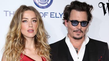 In this Jan. 9, 2016 file photo, Amber Heard, left, and Johnny Depp arrive at The Art of Elysium's Ninth annual Heaven Gala at 3LABS, in Culver City, Calif. Heard was in Los Angeles Superior Court court on Friday, May 27, 2016, and provided a sworn declaration that her husband Johnny Depp threw her cellphone at her during a fight Saturday, striking her cheek and eye. The judge ordered Depp to stay away from his estranged wife and ruled that Depp shouldn't try to contact Heard until a hearing is conducted on June 17. Heard filed for divorce on Monday. (Photo by Rich Fury/Invision/AP)