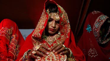 Pakistani brides attend a mass wedding ceremony in Karachi, Pakistan Monday, May 9, 2016. The mass marriage ceremony of 135 couples was organized and funded by a local non governmental organization for people who were unable to afford their own ceremony. (AP 