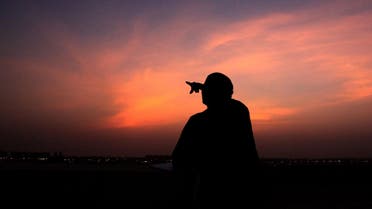 A Bahraini man points skyward at dusk Tuesday, Aug. 10, 2010, in Hamad Town, Bahrain, towards where a slim crescent moon should be visible to indicate the start of the Islamic holy month of Ramadan. (File photo: AP)