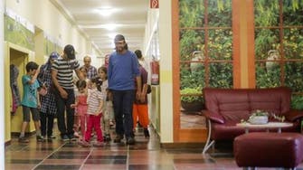 German town turns to Syrian refugees to save its school