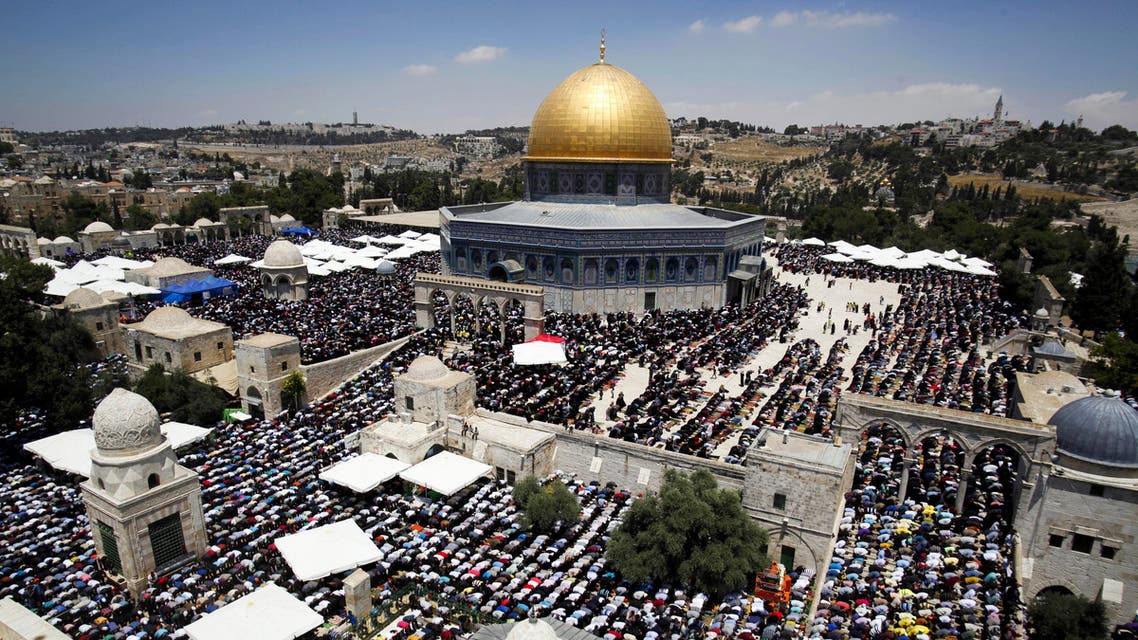  FILE - In this Friday, June 26, 2015, file photo, Palestinians pray around the Dome of the Rock shrine during the second Friday of the holy Muslim month of Ramadan in Jerusalem. (AP Photo/Mahmoud Illean, File)