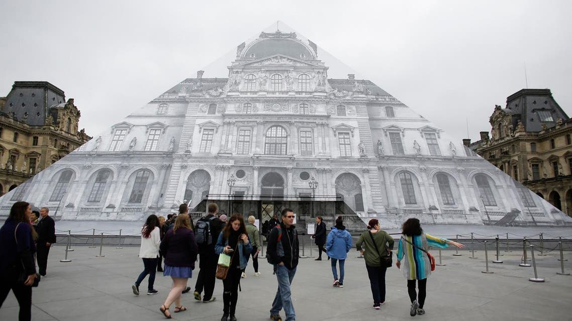 Visitors gather in front of the entrance of the Musee de Louvre which is closed and tourists being turned away, due to the unusually high water level of the nearby river Seine in Paris, Friday, June 3, 2016. (Photo: AP)
