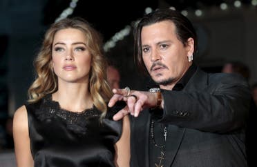 Cast member Johnny Depp and Amber Heard arrive for the premiere of the British film Black Mass in London, Britain on October 11, 2015. (Reuters)