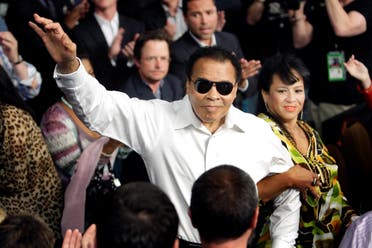 File photo of boxing legend Ali standing with his wife Yolanda as he is introduced at the MGM Grand Garden Arena in Las Vegas. (Reuters)