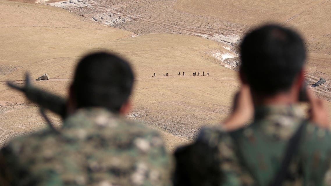Fighters of the Syria Democratic Forces take an overwatch position as their fellow fighters advance in the southern rural area of Manbij, in Aleppo Governorate, Syria May 31, 2016. (Reuters)