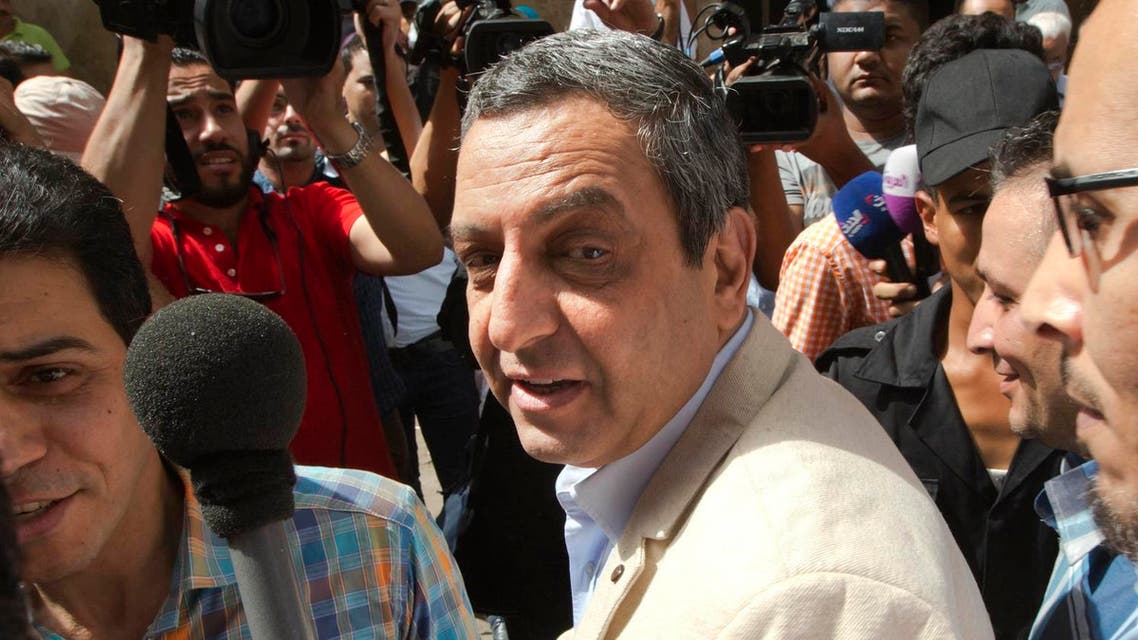 Yahia Kalash, the head of the journalists' union, is surrounded by cameramen as he arrives at Cairo south court in Cairo, Egypt, Saturday, June 4, 2016. The head of Egypt's journalists union and two of its board members are on trail over allegations that they harbored journalists wanted by authorities and spread false news. (AP)