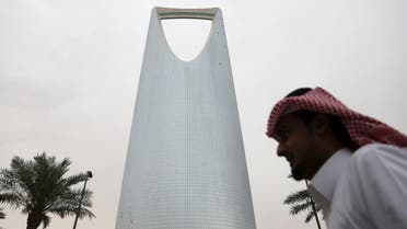 A man walks past the Kingdom Centre Tower in Riyadh, Saudi Arabia April 12, 2016. To match Insight SAUDI-ECONOMY/PLAN Picture taken April 12, 2016. REUTERS