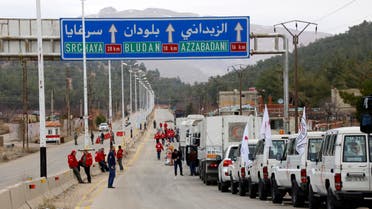 In this Monday, Jan. 11, 2016 photo, a convoy of vehicles loaded with food and other supplies organized by The International Committee of the Red Cross, working alongside the Syrian Arab Red Crescent and the United Nations makes its way to the besieged town of Madaya, about 15 miles (24 kilometers) northwest of Damascus, Syria. 9AP)