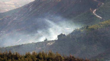 Smoke rises from the Syrian side of the border after a Turkish air force jet downed a Syrian military helicopter at the Turkey-Syria border near Hatay province, Turkey, Monday, Sept. 16, 2013. AP