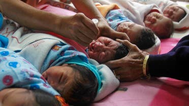 A medical worker administers polio drops to an infant at a hospital during the pulse polio immunization programme in Agartala, capital city of India's northeastern state of Tripura, January 18, 2015. The programme aims to immunize every child in the country under five years of age with the oral polio vaccine. REUTERS