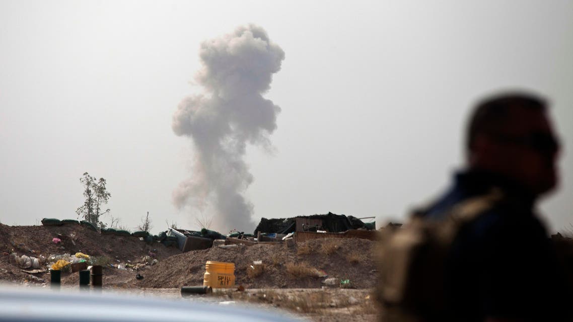 Smoke rises from a car bomb by Islamic State group on the front line in Fallujah, Iraq, Sunday, June 5, 2016. (AP)